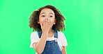 Wow, surprise and children with a girl on a green screen background standing hand over mouth. Portrait, face and gasp with an adorable little female child hearing gossip or a rumor on chromakey