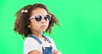 Green screen, fashion and face of child with sunglasses for trendy clothes, style and funky accessories in studio. Beauty, happy and portrait of girl with dance, comic and moving head with confidence