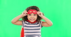 Happy child, superhero and portrait on green screen with a smile to fight with fantasy, dream or cosplay costume. Girl power, hero and game with strong kid to protect freedom and justice with a mask