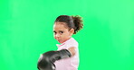 Boxing, sports and face of girl child on green screen in studio isolated on a background. Boxer, portrait and cute mixed race kid playing with gloves for exercise, workout or training on chroma key.