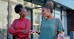 Black woman, friends and walking in city for communication, talking or socializing in the outdoors. Happy African American women discussing social life and friendship on sidewalk in an urban town