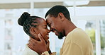 Black couple, forehead and smile for love, affection or romance together in happy relationship at home. African American man and woman touching heads laughing and smiling for loving embrace indoors