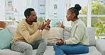 Black couple, argument and talking on sofa in disagreement, conflict or divorce in living room at home. Angry African American man and woman in fight for communication, disagree or arguing on couch