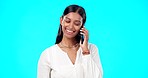 Happy phone call, business woman and studio with a Indian female talking and speaking. Mobile communication, online discussion and networking of a young person smile with isolated blue background