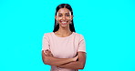 Smile, confident and portrait of woman arms crossed excited, proud and isolated in a studio blue background. Leader, confidence and female with a positive mindset relax, calm and happy person