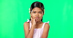 Thinking, green screen and curious kid wondering a question feeling confused, thoughtful and isolated in studio background. Planning, girl and child contemplating, idea and planning expression