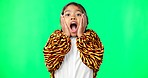 Girl child, shock face and green screen studio with tiger pyjamas, costume and wow with hands on face. Female kid, surprise facial expression and mock up portrait for news with space by background