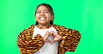 Heart, green screen and love hand sign by kid excited, smile and excited isolated in studio background. Young, care and support gesture by girl or kid in tiger costume showing symbol or shape