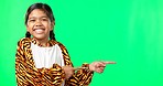 Product placement, pointing and face of a child on a green screen isolated on a studio background. Laughing, branding and portrait of a girl gesturing to mockup space for a logo or marketing