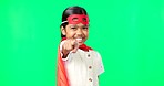 Superhero, point and face of child on green screen for fantasy, cosplay costume and comic character. Choose gesture, hero mockup and portrait of girl in studio for freedom, fight crime and games