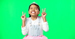 Peace, fun and hand gesture with a girl on a green screen background in studio feeling silly or carefree. Portrait, dance and emoji with an adorable little female child looking goofy or playful