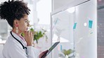 Doctor, woman and tablet thinking in planning, schedule or healthcare tasks on glass board. Thoughtful female medical expert with touchscreen for project plan, sticky note or brainstorming strategy