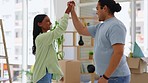 Couple, high five and hug for real estate, new home or property in celebration for relationship success. Happy man and woman hugging or touching hands for house loan, mortgage or moving in together