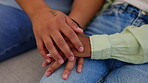 Hands, love and support with a couple in the living room of their home for help, care or comfort closeup. Depression, empathy or trust with a man and woman together during the tragedy of loss or pain