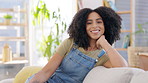 Face, smile and woman relax on sofa, couch and living room for easy lifestyle, me time or happiness. Happy portrait of young female resting in lounge, apartment and self care for freedom of peace 