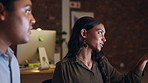 Training, computer or man explaining to an Indian woman helping, advice or talking in office. Late night, coaching or new employee learning online or digital skills from leader or mentor in overtime 