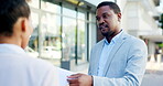 Sales, insurance and businessman or salesman talking to a client explaining using a clipboard outdoors in a city or town. Advice, explain and male agent having a conversation in the street