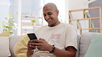 Happy, man and scroll on smartphone couch and lounge for reading social media post, online chat and search. Male, smile and typing on cellphone in house, download mobile games and relax for texting