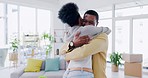Love, happy and black couple hug in lounge, cheerful and bonding with joy, loving together and romance. Romantic, man and woman embrace, relationship and reunion in living room, marriage and smile