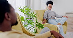 Relax, conversation and laugh with black couple in living room for communication, bonding and break. Happiness, discussion and weekend with man and woman at home for positive, free time and lounge