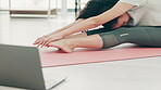 Woman, laptop and stretching for home workout, yoga training and online class. Fitness female, warm up and computer in living room for muscle mobility, wellness and pilates subscription in apartment 