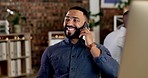 Office, smile and man on a phone call while working on a corporate project with a laptop. Happiness, technology and professional male employee on a mobile conversation with cellphone in workplace.