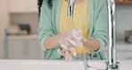 Washing hands, woman and kitchen sink of a female with soap for cleaning and wellness. Home, safety and virus protection of a person with sanitary healthcare in a house for skincare and grooming