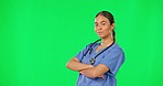 Healthcare, confidence and woman nurse on green screen with mockup space and chromakey background. Medicine, doctor or medical professional in studio with arms crossed, mock up and motivation to help