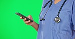Phone, green screen and woman hand of nurse in a studio with mobile communication and text. Female, healthcare and worker on a web chat and social media scroll of a hospital and clinic employee