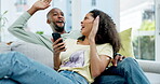 Happy black couple, phone and celebration on sofa for winning, competition or prize in living room at home. African Man and woman in joyful happiness for win, sale or discount on mobile smartphone