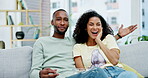 Laughing, popcorn and couple watching tv in home, bonding and enjoying comedy movie. Interracial, television and funny black man and woman eating food, streaming or comic video, relax or talk on sofa