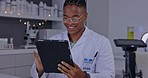 Scientist, tablet and lab research in night for science, pharmaceutical study and data analysis on app. Black man, touchscreen and analytics in laboratory for pharma strategy, goal and innovation