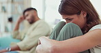 Unhappy woman, divorce and couple on couch, anxiety and partnership in living room. Fight, male and female in lounge, sofa and anxious with depression, mental health and relationship issue or problem