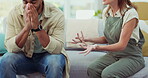 Couple, argument and conflict in disagreement on sofa in living room dispute or unhappy relationship at home. Frustrated woman and man upset in breakup, affair or fight for cheating or infertility