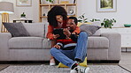 Black couple, tablet and hug on living room sofa for streaming entertainment or relaxing at home. Happy African man and woman smiling on touchscreen for wifi, browsing or social media by couch