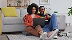 Couple, online shopping and credit card with laptop on floor in home living room for retail sale, deal or choice. Black man, woman and computer for digital banking, e commerce or payment for discount