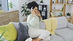 Dance, phone and music with woman on sofa for freedom, carefree and streaming. Energy, mobile radio and happy with female listening to headphones at home for audio, subscription service or connection