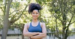 Fitness, woman and confidence with arms crossed for workout, exercise or training in nature. Portrait of happy, fit and confident female runner with smile for sports, run or healthy wellness in park