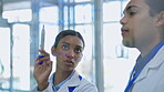 Glass, medical and employees with research, planning and discussion with target, brainstorming or discovery. Scientists, man and woman writing, share ideas or healthcare solutions, formula or talking