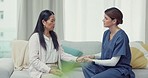 Holding hands, consultation or Asian woman explaining to nurse about health problems for rehabilitation. Consulting, healthcare or mature patient talking or speaking to doctor for helping advice