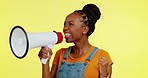 Megaphone announcement, scream and black woman protest for democracy vote, justice noise or human rights rally. Racism speech fist, female voice or face of serious studio speaker on yellow background