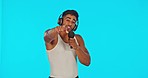 Singer, love song and man with microphone and headphones in studio to sing on blue background. Male model, artist or musician portrait for hip hop music performance for a live concert or event