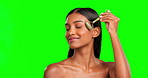 Happy woman, face roller and beauty on green screen, studio and crystal cosmetics. Skincare, portrait and female model with facial stone tool for dermatology, aesthetic glow and lymphatic drainage 