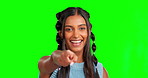 Portrait, pointing and decision with a woman on a green screen background in studio selecting her choice. Face, hand and selection with an attractive young female on chromakey mockup to point at you