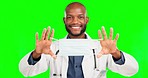 Covid doctor, face mask or happy black man for medical safety, healthcare compliance or hospital clinic policy. Green screen portrait, virus protection or male chroma key surgeon on studio background