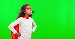 Superhero, costume and child in a studio with green screen with mockup space for advertising. Mask, young and girl kid with wind blowing her cosplay outfit to stop crime by a chroma key background.