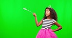 Child in costume, mockup with wand and crown on green screen with magic princess dress up in studio. Fantasy, play and girl with tiara and showing fun mock up space for birthday games for children.