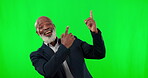 Showing, face and a black man pointing on a green screen isolated on a studio background. Happy, looking and portrait of a senior African person gesturing to mockup space on a chromakey backdrop