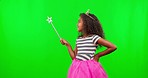 Child in costume, mockup with wand and smile on green screen with crown and magic princess dress up in studio. Fantasy, play and girl with tiara in fun mock up space for birthday games for children.