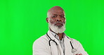 Face, doctor and black man with green screen, serious and career mindset against a studio background. Portrait, African American male employee and physician with arms crossed, assertive and emergency